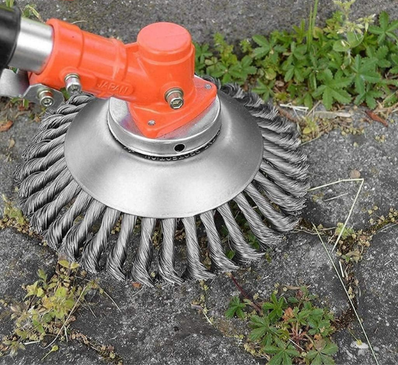 Precision brush cutter attached to a trimmer, effectively removing weeds and grass from outdoor surfaces.