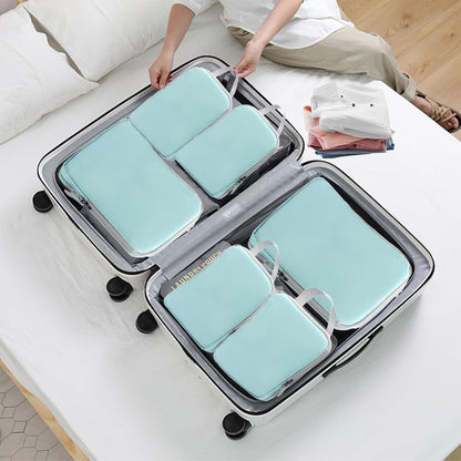 Set of organized travel bags with a sleek, compact design, featuring multiple sizes and zippers for efficient storage. Perfect for keeping clothes, toiletries, and travel essentials neatly arranged during trips. Lightweight and durable for convenient and stress-free travel.