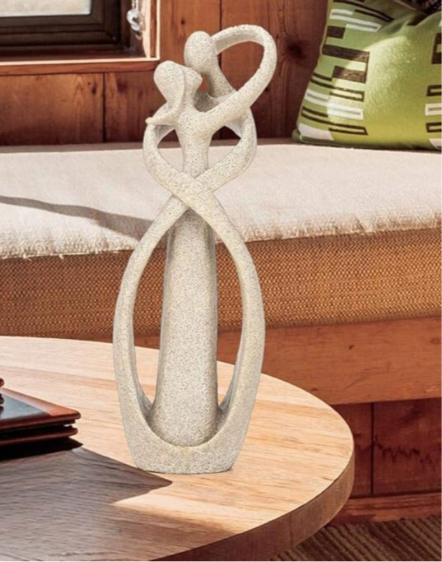 Elegant artistic sculptures showcasing intertwined figures, perfect for enhancing home décor with a touch of sophistication and timeless design.