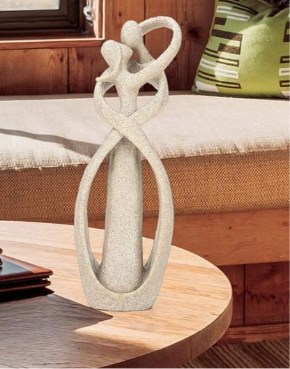 Elegant artistic sculptures showcasing intertwined figures, perfect for enhancing home décor with a touch of sophistication and timeless design.