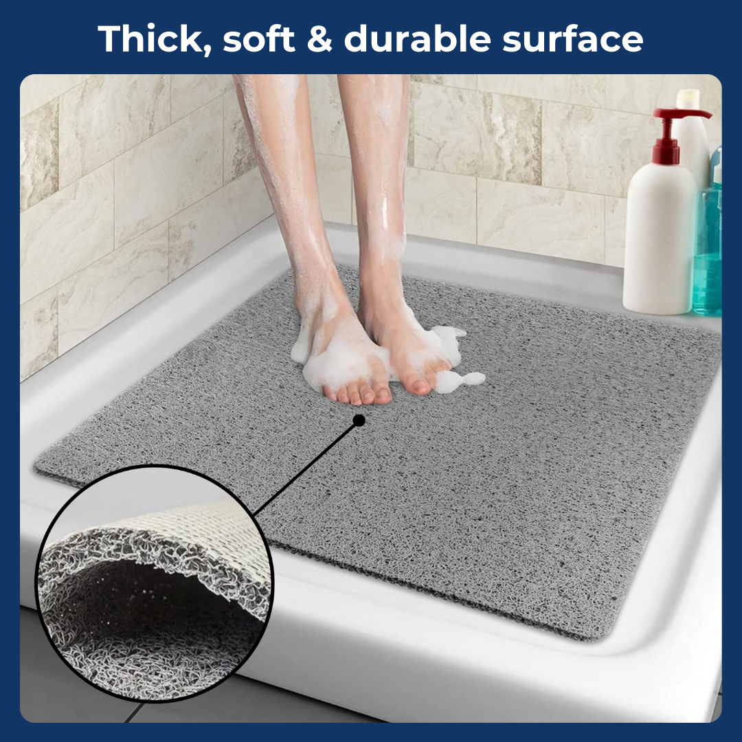  A bathroom anti-slip mat placed near a shower with a person stepping onto it, featuring a quick-dry design and textured surface for enhanced grip and safety.