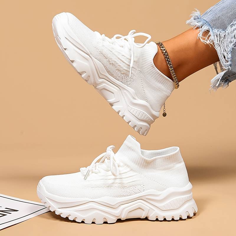 Image showcasing a pair of breathable women's sneakers with a sleek and lightweight design, featuring lace-up closure and a comfortable sole, ideal for casual wear and active lifestyles.