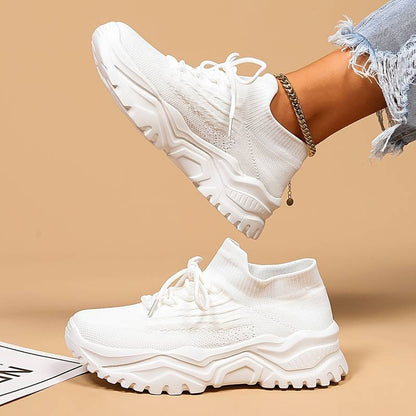 Image showcasing a pair of breathable women's sneakers with a sleek and lightweight design, featuring lace-up closure and a comfortable sole, ideal for casual wear and active lifestyles.