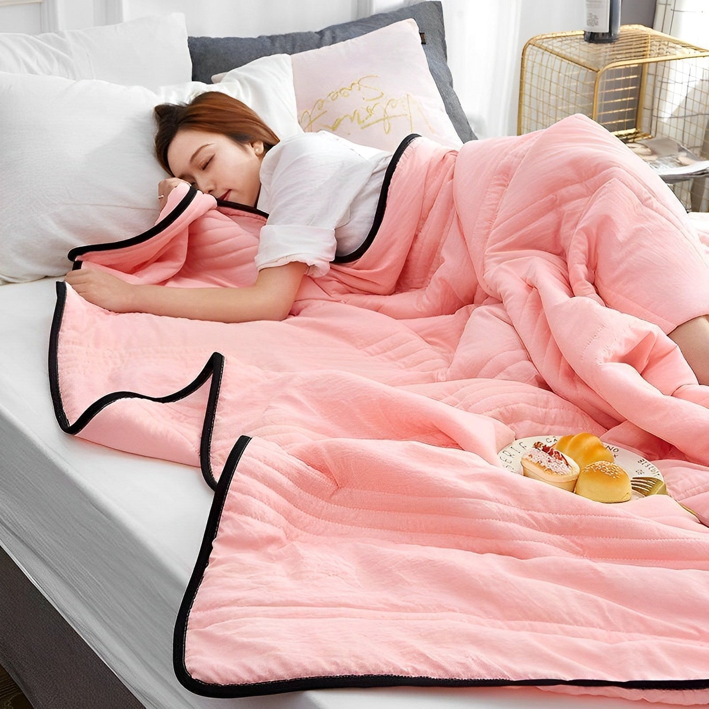 Woman peacefully sleeping wrapped in an ultra-soft blanket, showcasing its cozy and luxurious texture on a neatly made bed.