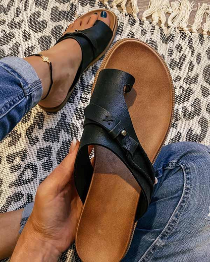 Women's stylish sandals with a comfortable design, perfect for casual outings and everyday wear, shown paired with jeans for a relaxed look.