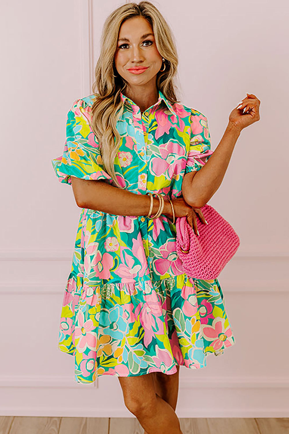 Back view of the Lily Women's Floral Tiered Dress, showcasing a vibrant floral pattern with tiered layers and short puff sleeves.