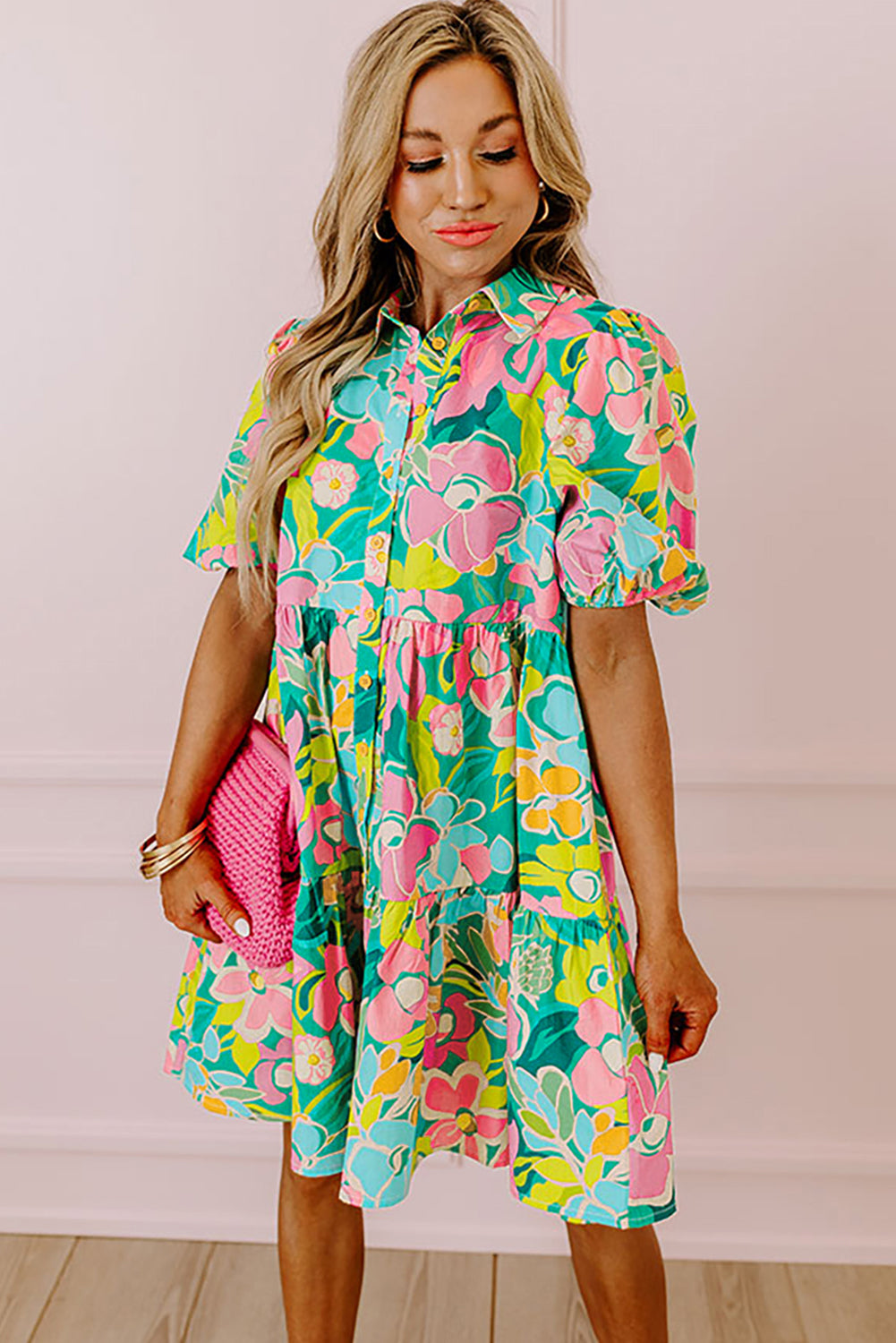 Back view of the Lily Women's Floral Tiered Dress, showcasing a vibrant floral pattern with tiered layers and short puff sleeves.