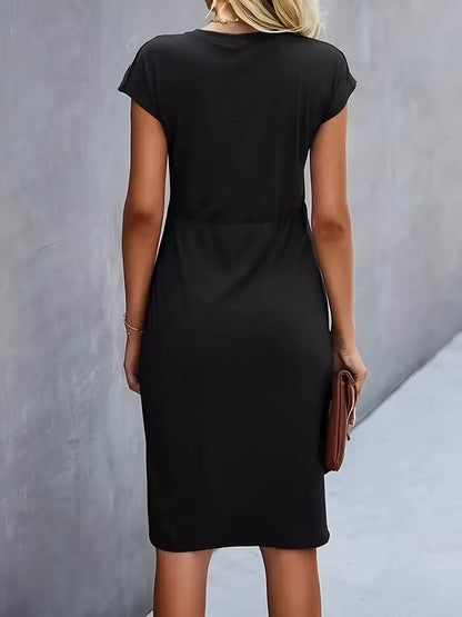 A woman wearing an elegant dress with a flattering ruched design, perfect for both casual outings and formal events. The dress highlights a sophisticated and stylish silhouette, paired with a clutch for a polished look.