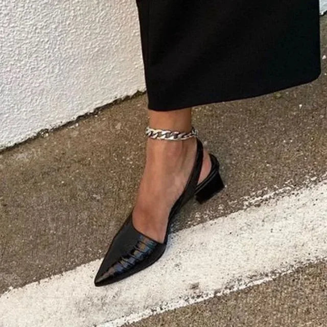 A pair of Amelia Women's Chic Block Heel Shoes with a stylish double-strap design and comfortable block heels, showcased to highlight their elegance and versatility for both casual and formal occasions.