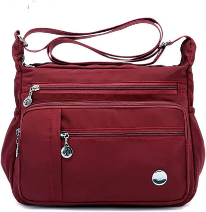  Functional multi-pocket bag with adjustable strap, multiple zippered compartments, and side pockets, offering ample space for daily essentials. Compact and lightweight design for easy carrying. Perfect for organization and travel use.