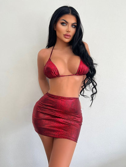 Model wearing the Mia | Bold Two-Piece Mini Skirt Set, featuring a daring bikini-style top and a form-fitting mini skirt. Perfect for a night out or special events, this set showcases a bold, confident look.