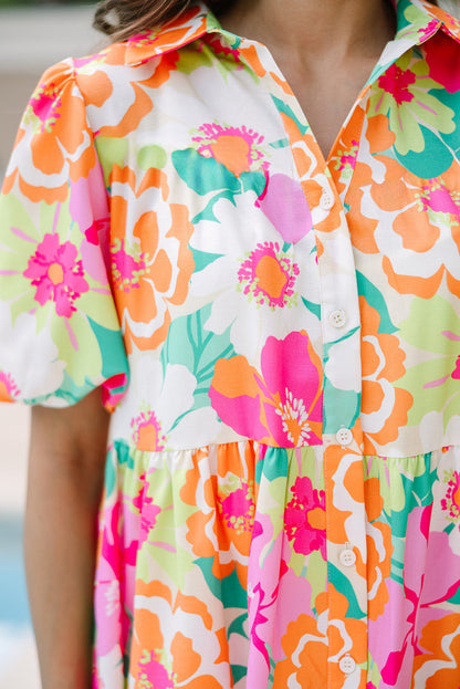 Back view of the Lily Women's Floral Tiered Dress, showcasing a vibrant floral pattern with tiered layers and short puff sleeves.