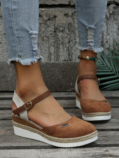 An image showcasing stylish women's wedge sandals with a comfortable design, featuring adjustable ankle straps and a supportive sole, perfect for casual or semi-formal outings.