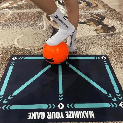 Person using an athletic trainer mat with a ball, showcasing its design for improving coordination, agility, and footwork during training sessions.