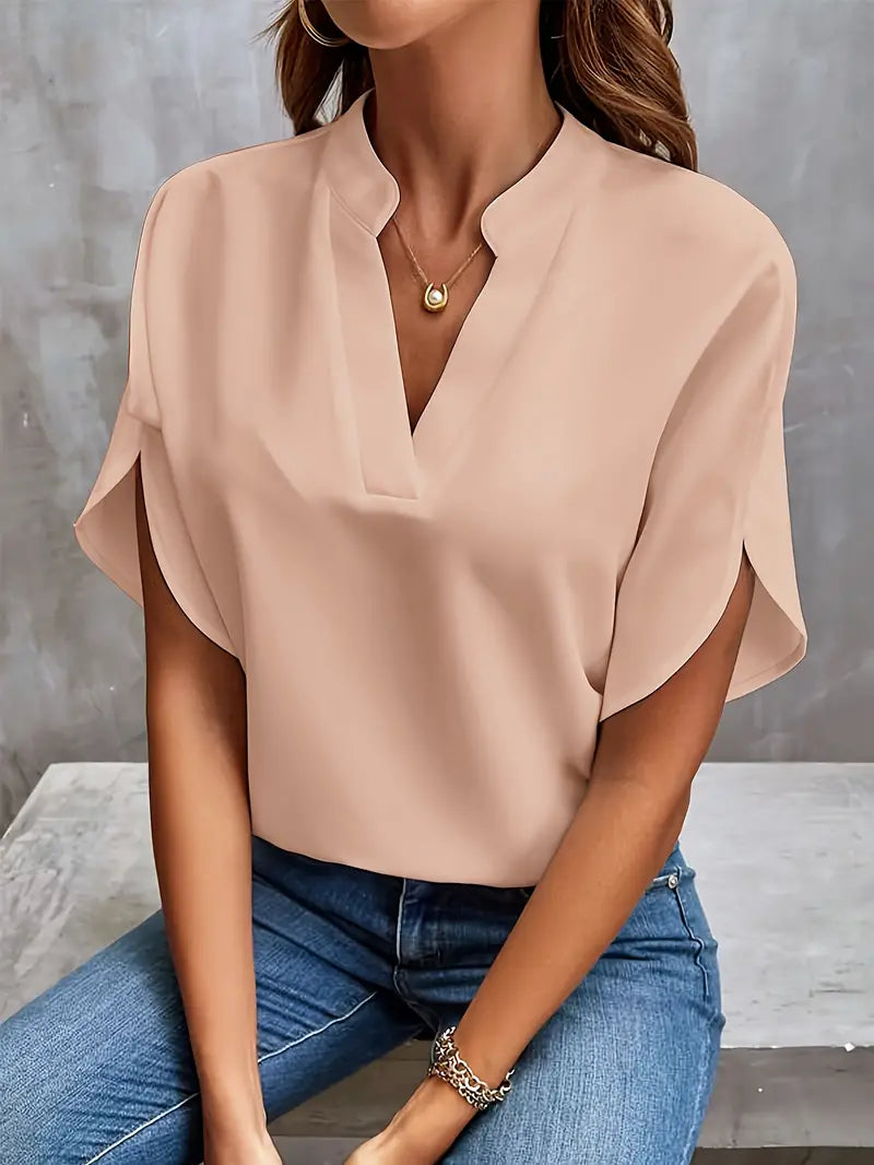 Image showing a woman wearing the Clara Women's Stylish Top, featuring a sleek and elegant design with a flattering neckline, paired with jeans for a chic and versatile look.