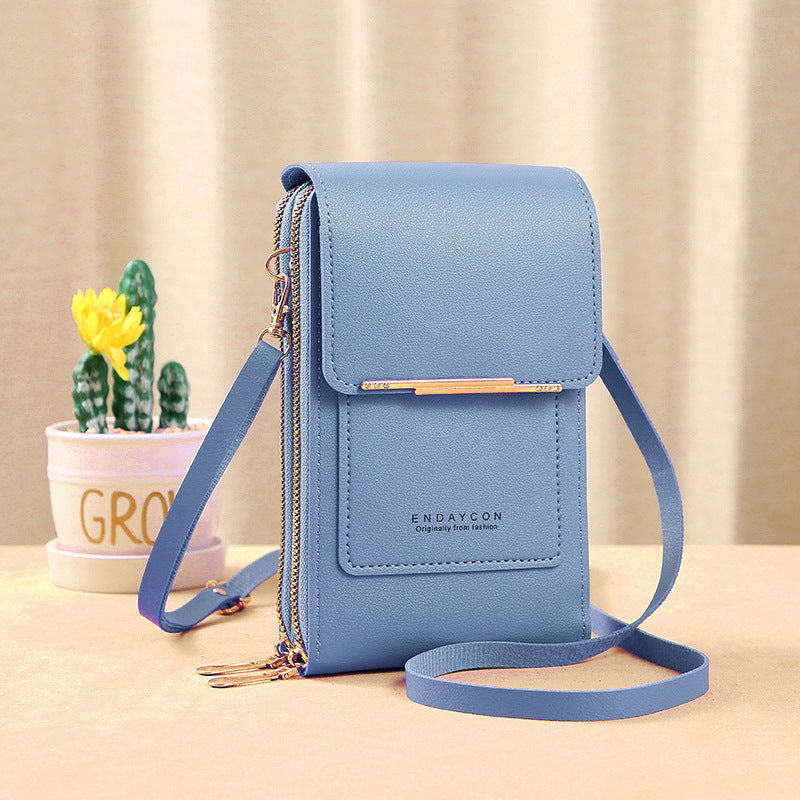 Image showing a compact and stylish women's crossbody bag with a sleek design, featuring a front flap, zipper closure, and an adjustable strap, ideal for carrying essentials on the go.