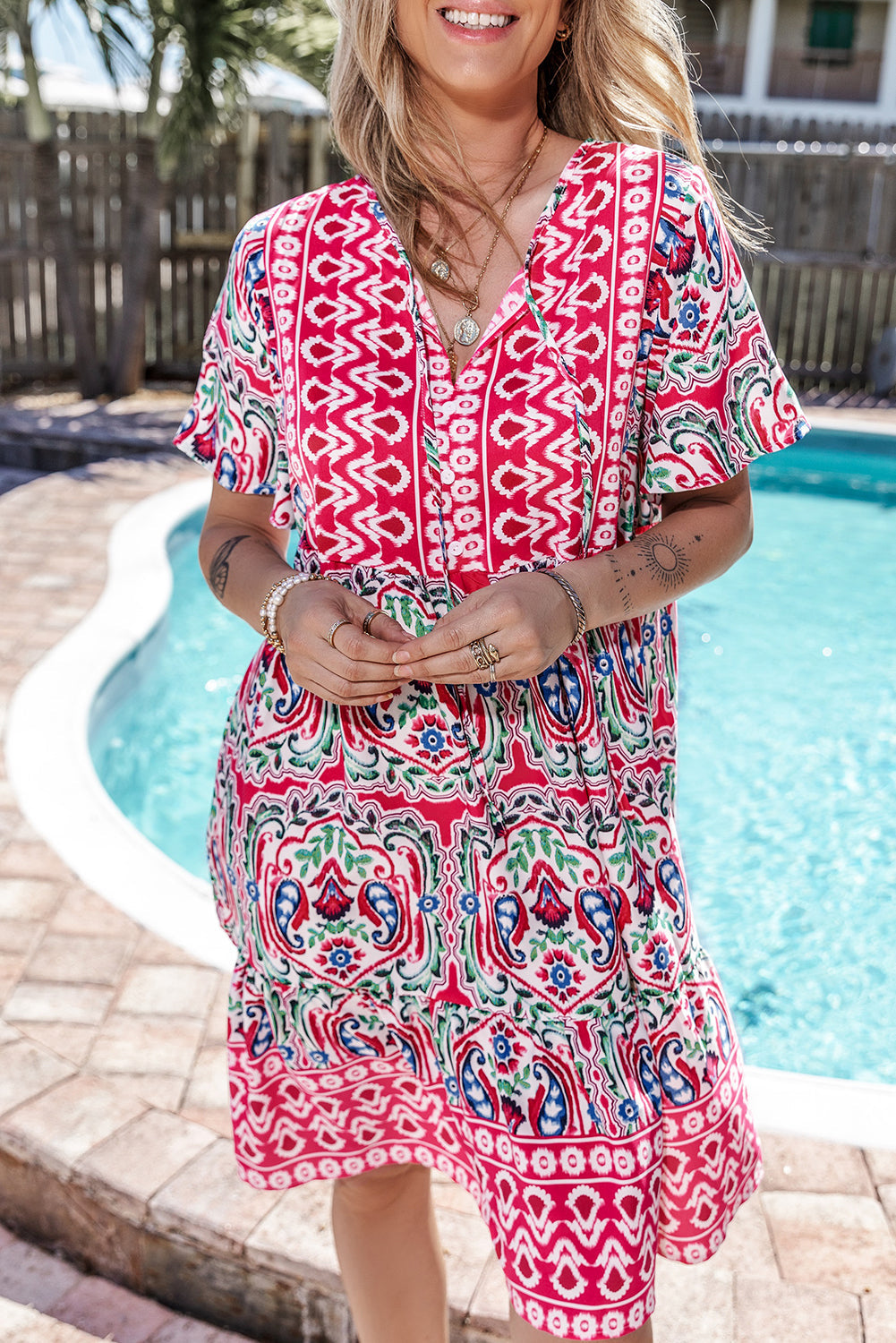 Woman wearing the Mila Women's Vibrant Boho Dress with a relaxed fit, featuring a lively bohemian print and flowy design, ideal for casual and sunny settings.