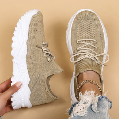 Image showcasing a pair of breathable women's sneakers with a sleek and lightweight design, featuring lace-up closure and a comfortable sole, ideal for casual wear and active lifestyles.