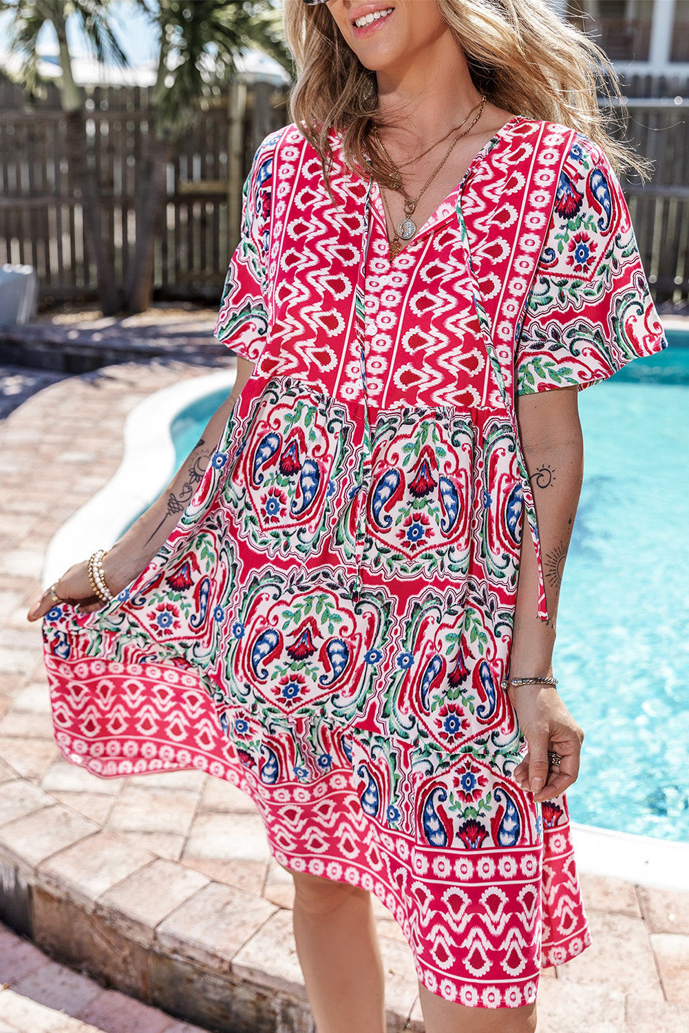 Woman wearing the Mila Women's Vibrant Boho Dress with a relaxed fit, featuring a lively bohemian print and flowy design, ideal for casual and sunny settings.
