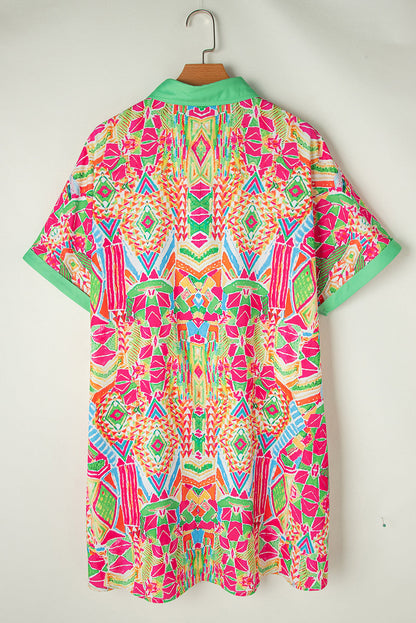 Woman wearing the Zara Women's Geometric Button-Down Dress with a vibrant pattern, accessorized with a handbag and bold jewelry. The dress features a relaxed fit and geometric design, perfect for a stylish and casual look.