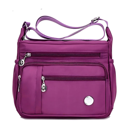  Functional multi-pocket bag with adjustable strap, multiple zippered compartments, and side pockets, offering ample space for daily essentials. Compact and lightweight design for easy carrying. Perfect for organization and travel use.
