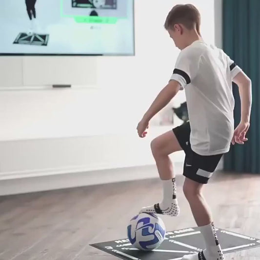 Person using an athletic trainer mat with a ball, showcasing its design for improving coordination, agility, and footwork during training sessions.