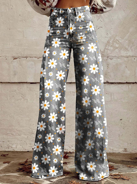 A pair of Jasmine Women's Boho Wide-Leg Pants featuring a bold floral print with nature-inspired patterns, including flowers and butterflies. These wide-leg pants have a relaxed fit, perfect for adding a boho touch to any casual or festival outfit.