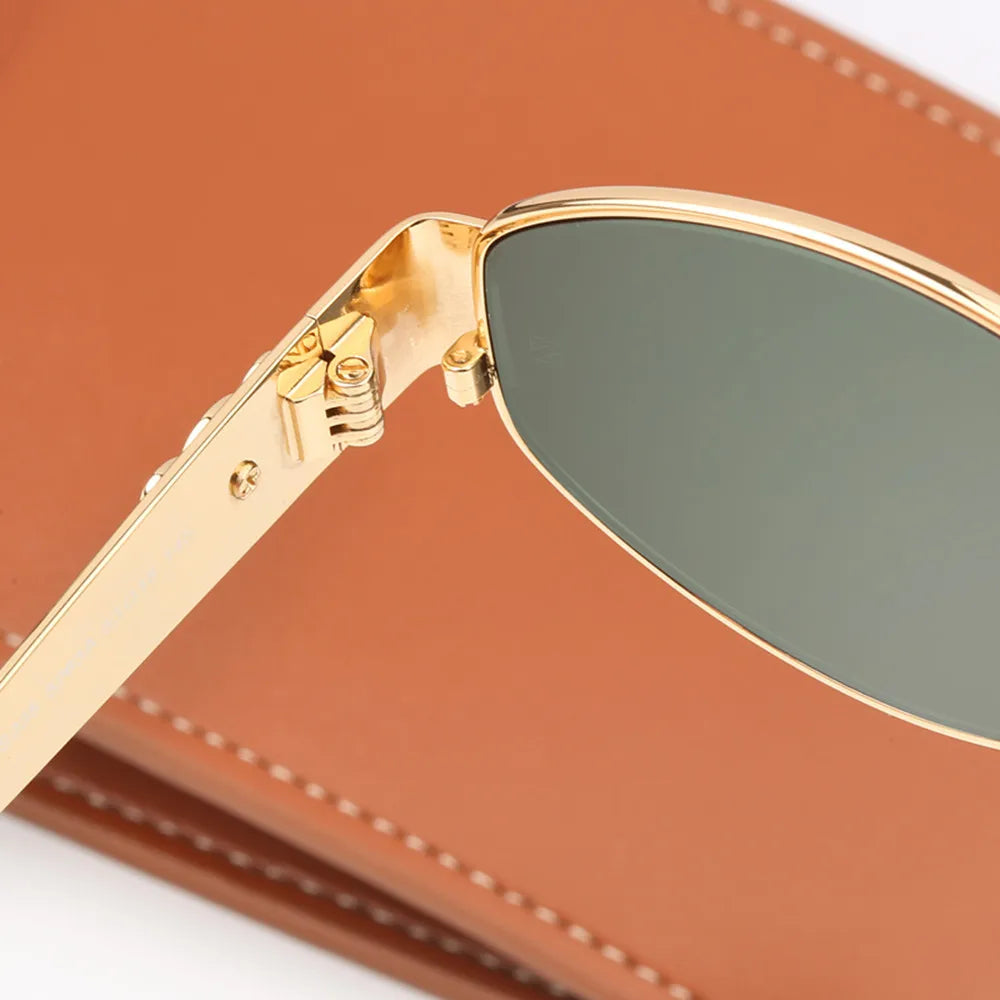 A pair of elegant women's sunglasses with a chic oval frame and stylish detailing, perfect for enhancing any outfit and providing essential UV protection. Designed for a lightweight and comfortable fit, ideal for daily wear or special occasions.