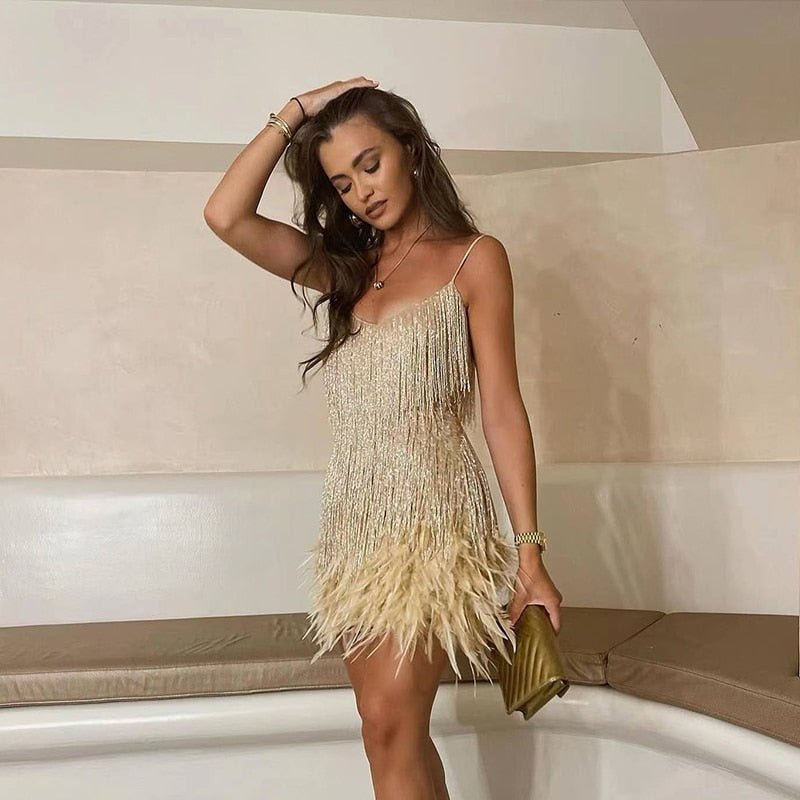 Model wearing the Aria Women's Fringe Mini Dress, a chic party dress with fringe detailing at the hem and bodice, perfect for creating a stylish and glamorous look for a night out.