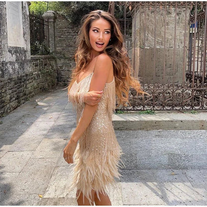 Model wearing the Aria Women's Fringe Mini Dress, a chic party dress with fringe detailing at the hem and bodice, perfect for creating a stylish and glamorous look for a night out.