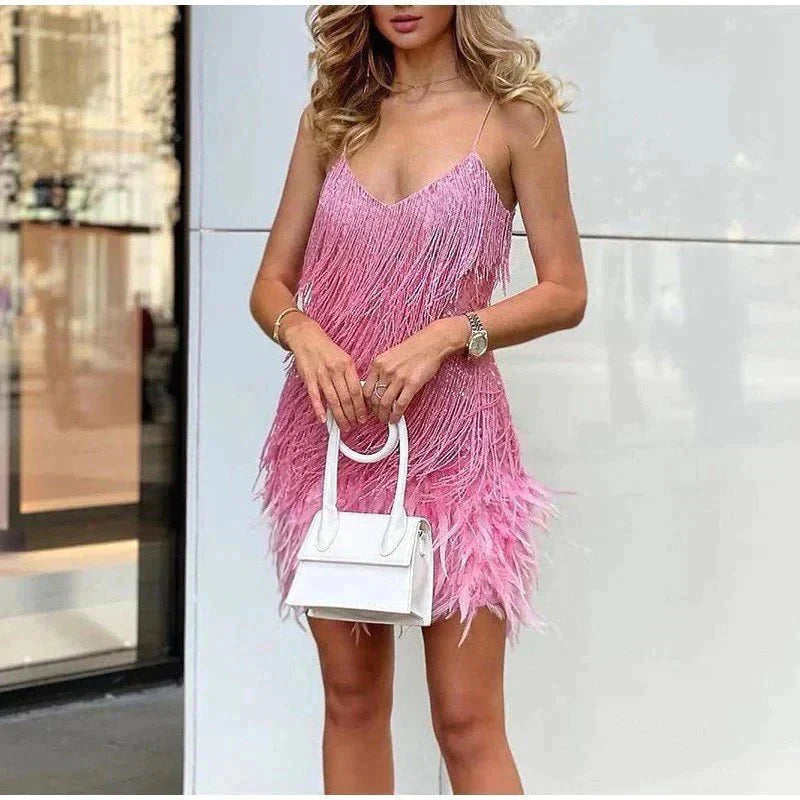 Model wearing the Aria Women's Fringe Mini Dress, a chic party dress with fringe detailing at the hem and bodice, perfect for creating a stylish and glamorous look for a night out.