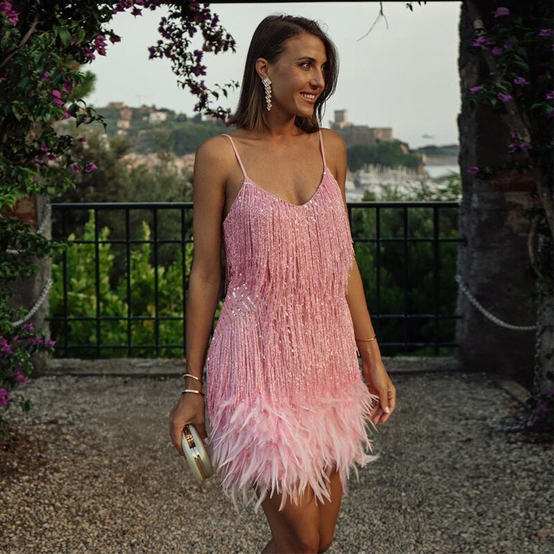 Model wearing the Aria Women's Fringe Mini Dress, a chic party dress with fringe detailing at the hem and bodice, perfect for creating a stylish and glamorous look for a night out.