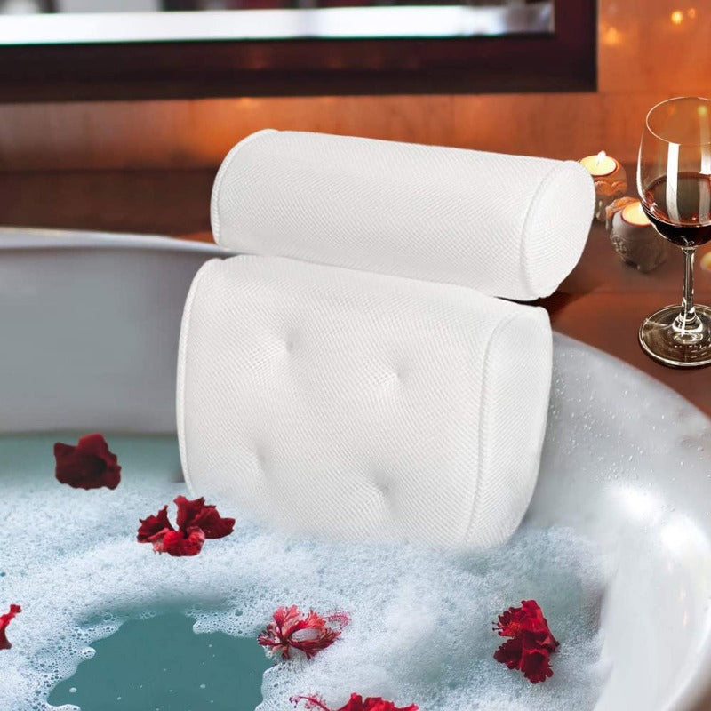 Bath pillow with ergonomic design featuring a cushioned headrest and padded back support, placed on a bathtub for enhanced comfort and relaxation.