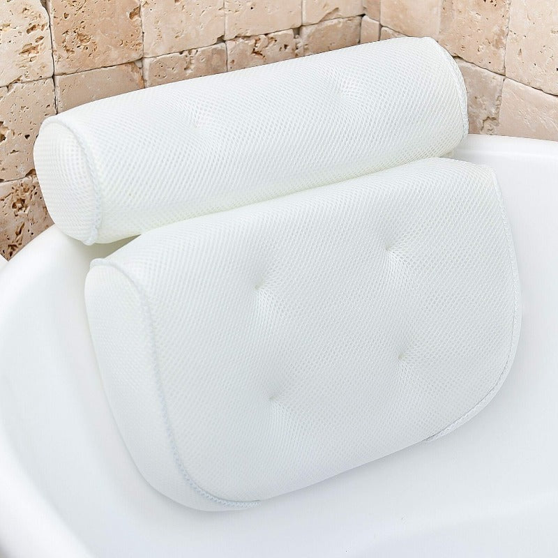 Bath pillow with ergonomic design featuring a cushioned headrest and padded back support, placed on a bathtub for enhanced comfort and relaxation.