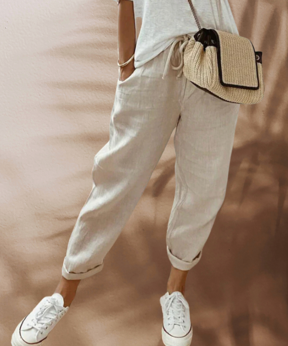 Woman wearing casual linen pants with a relaxed fit, featuring an adjustable drawstring waistband, perfect for everyday comfort and style.