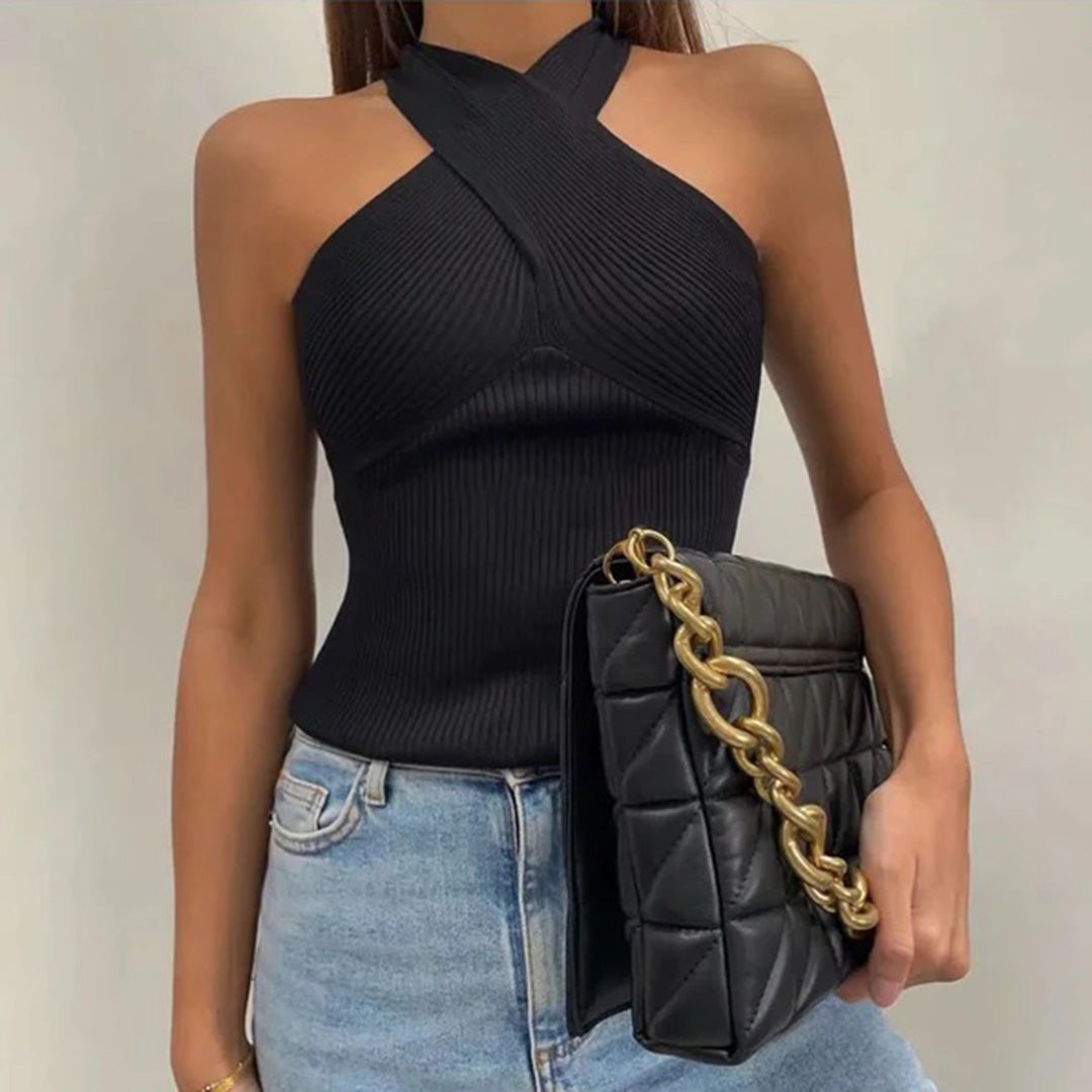 Women's elegant halter top with a fitted design, featuring a cross-over neckline for a stylish and sophisticated look.
