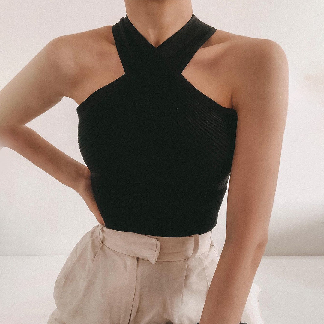 Women's elegant halter top with a fitted design, featuring a cross-over neckline for a stylish and sophisticated look.