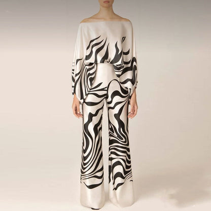 Women's summer jumpsuit with a flowing, one-shoulder design featuring vibrant patterns. Perfect for casual outings, beach days, or evening events, combining elegance and comfort for a chic summer look.