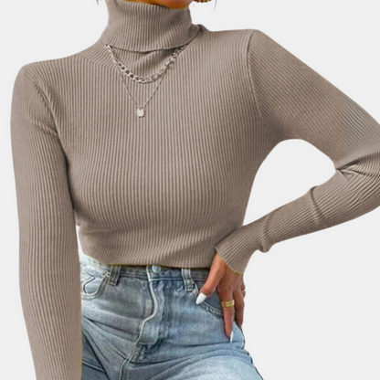 Model wearing the Sophia Women's Ribbed Turtleneck Top, showcasing its sleek, slim-fit design and high turtleneck style, paired with casual jeans.