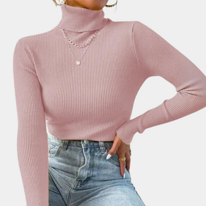 Model wearing the Sophia Women's Ribbed Turtleneck Top, showcasing its sleek, slim-fit design and high turtleneck style, paired with casual jeans.