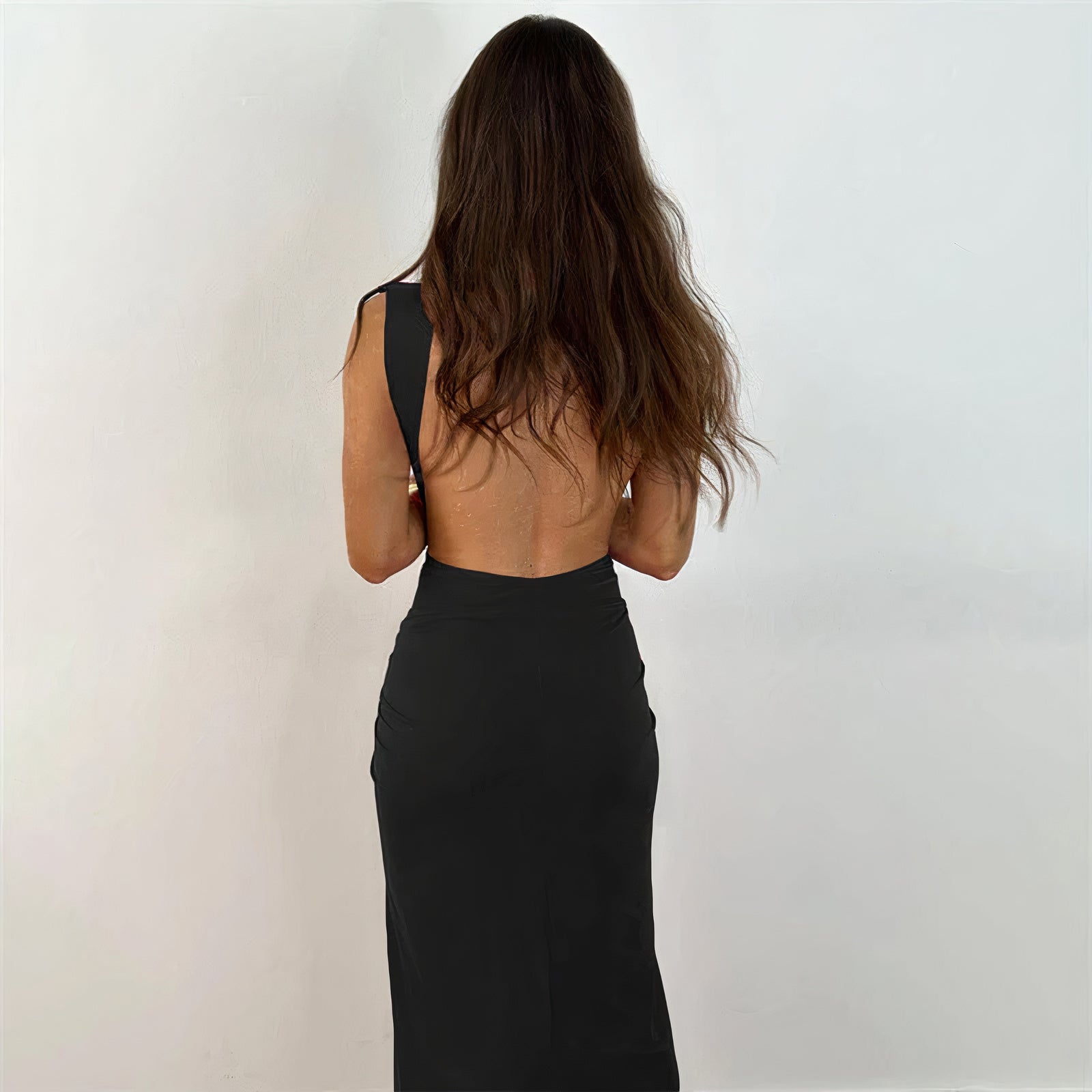  Woman wearing the Luna Women's Ruched High-Slit Dress, featuring a sleeveless design with a high slit and elegant ruched detailing, ideal for a sophisticated party look.