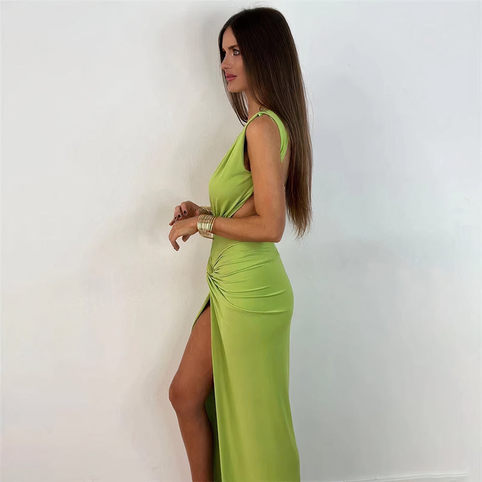  Woman wearing the Luna Women's Ruched High-Slit Dress, featuring a sleeveless design with a high slit and elegant ruched detailing, ideal for a sophisticated party look.
