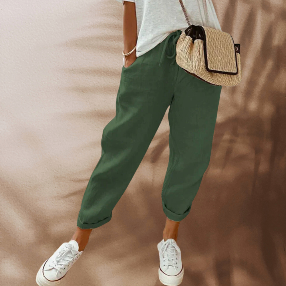 Woman wearing casual linen pants with a relaxed fit, featuring an adjustable drawstring waistband, perfect for everyday comfort and style.