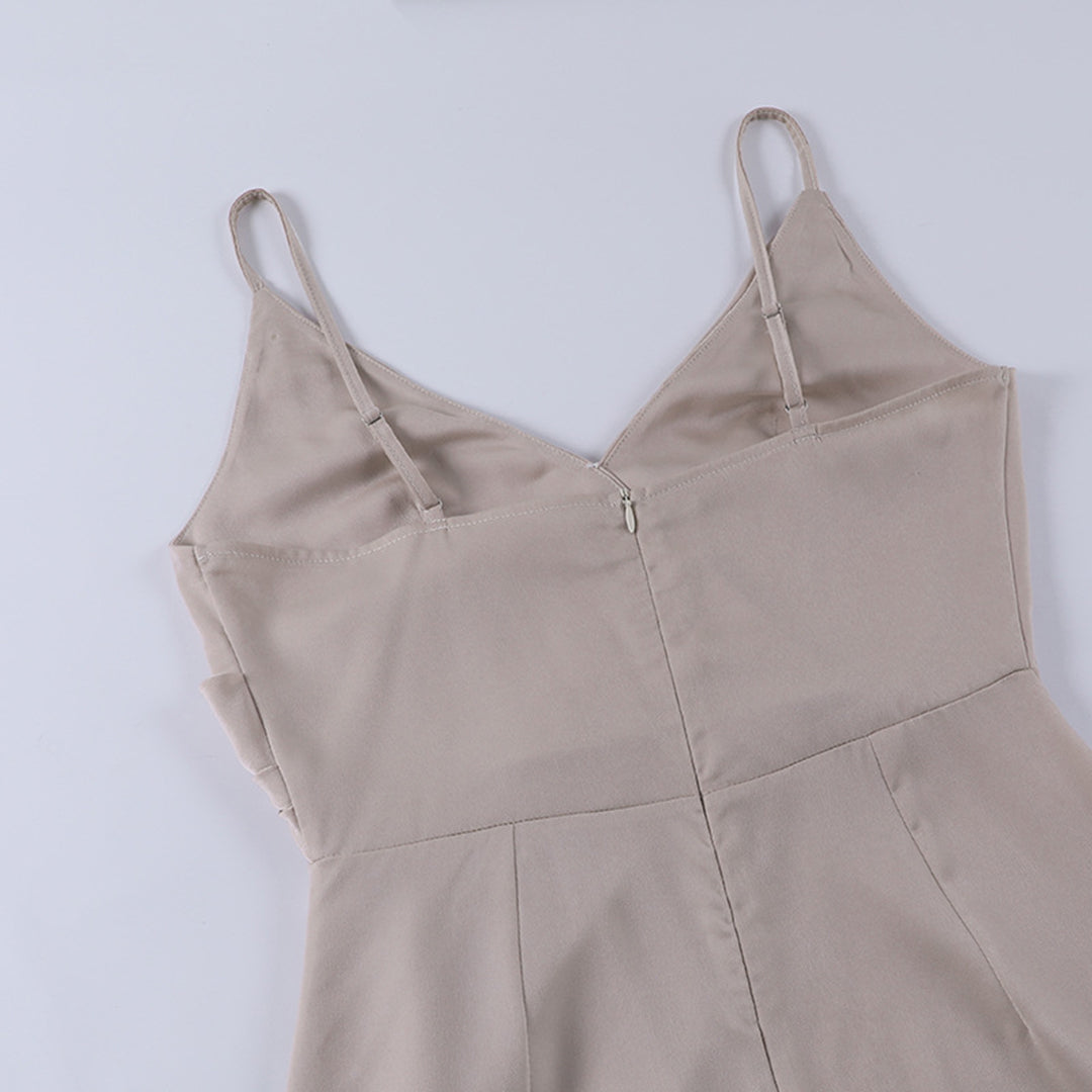 Woman wearing the Eva Women's Sleek Wrap Dress, featuring a high slit and elegant wrap design, perfect for evening events and formal occasions.