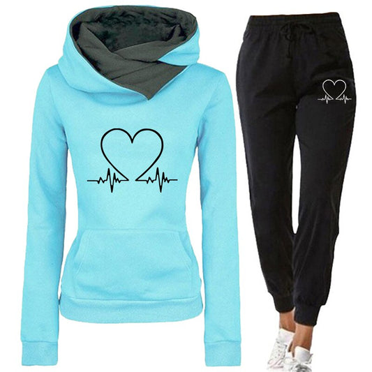 Women's comfortable tracksuit featuring a stylish design with a heart and heartbeat graphic, perfect for casual wear, workouts, or lounging.
