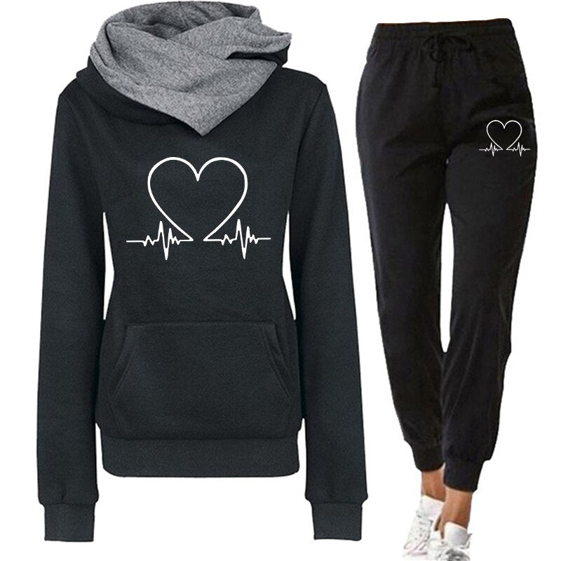 Women's comfortable tracksuit featuring a stylish design with a heart and heartbeat graphic, perfect for casual wear, workouts, or lounging.