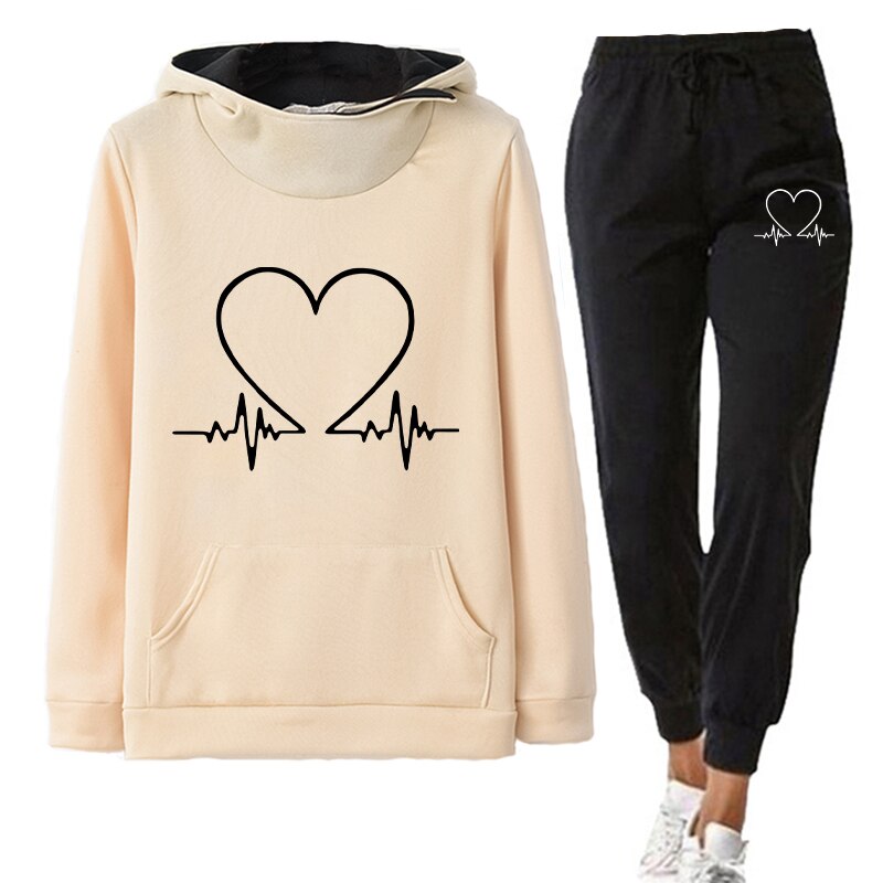 Women's comfortable tracksuit featuring a stylish design with a heart and heartbeat graphic, perfect for casual wear, workouts, or lounging.