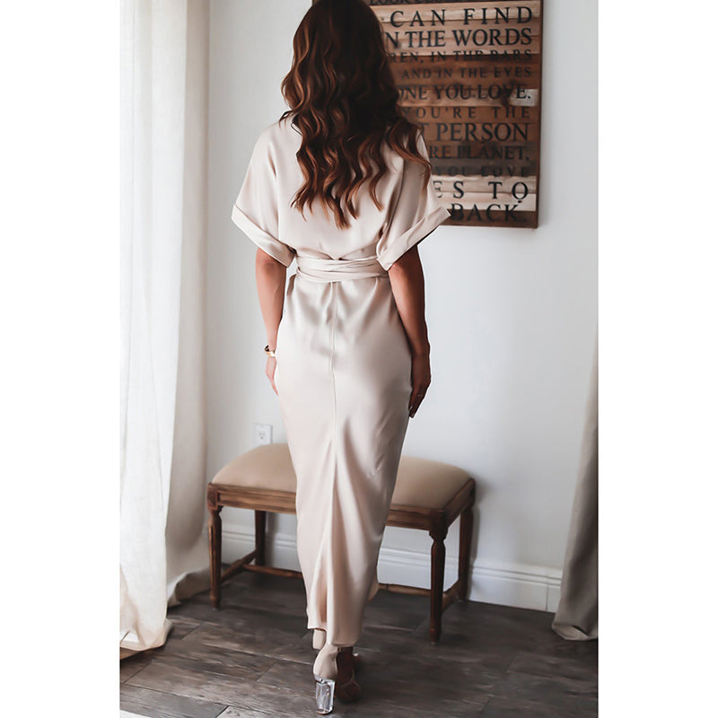 Woman wearing the Celeste Women's Kimono Sleeve Maxi Dress, a sophisticated party dress with elegant kimono sleeves and a fitted waist, standing gracefully in a stylish indoor setting.