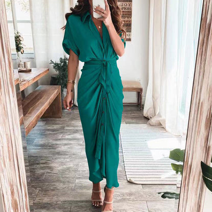 Woman wearing the Celeste Women's Kimono Sleeve Maxi Dress, a sophisticated party dress with elegant kimono sleeves and a fitted waist, standing gracefully in a stylish indoor setting.