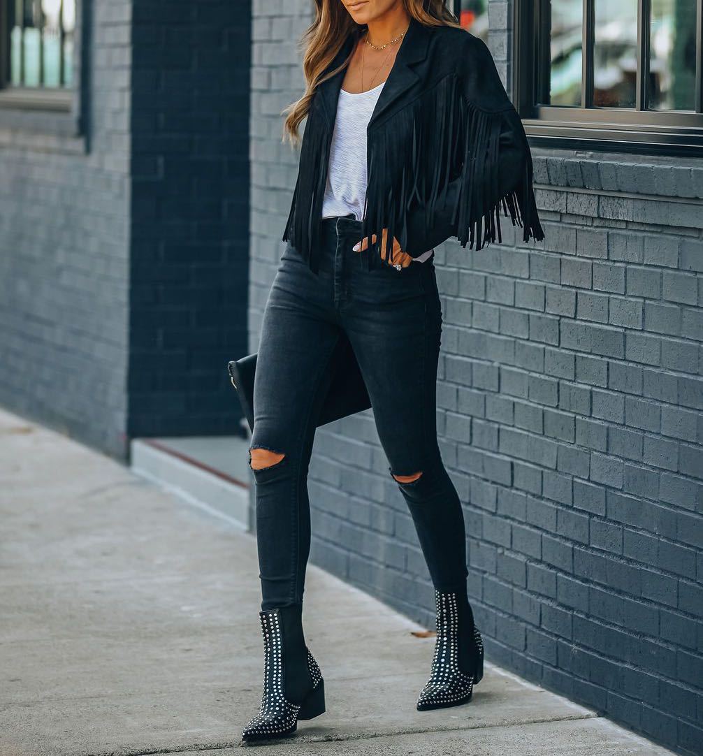 Woman wearing the Brooke | Stylish Fringe Detailed Jacket, styled with distressed jeans, ankle boots, and a casual top, showcasing the jacket’s fringe detail and trendy look perfect for casual and chic outfits.